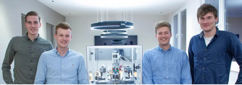 The team behind the Rubik's cube solving machine.